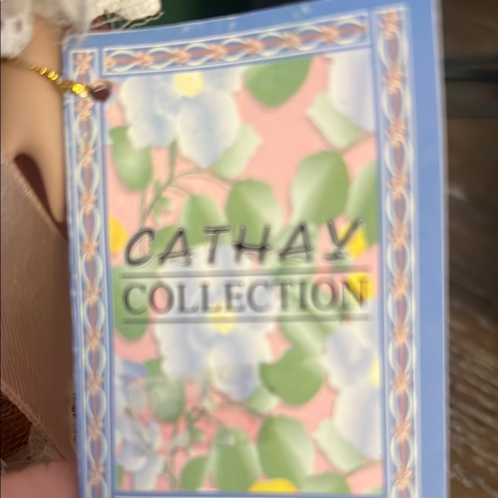 Charming Porcelain Doll in Peach Dress - Picture 3 of 4